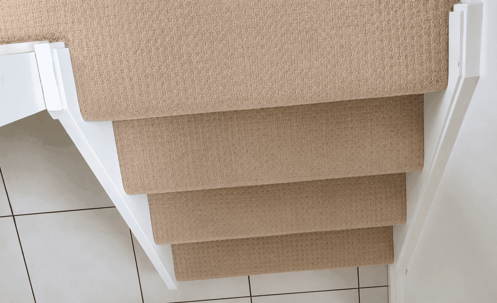Carpeted stairs after professional carpet cleaning, showing cleaner and refreshed carpet fibres following deep steam cleaning.